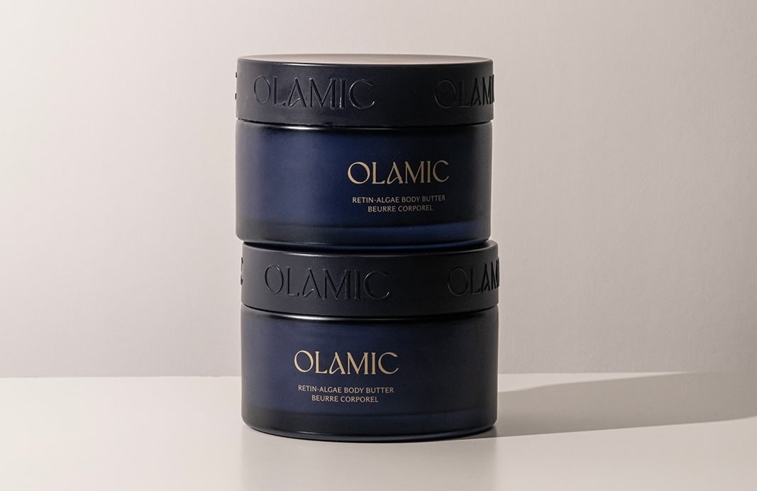 Stack of Olamic containers on a light gray background