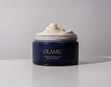 Jar of OLAMIC Retin-Algae Body Butter with rich cream overflowing