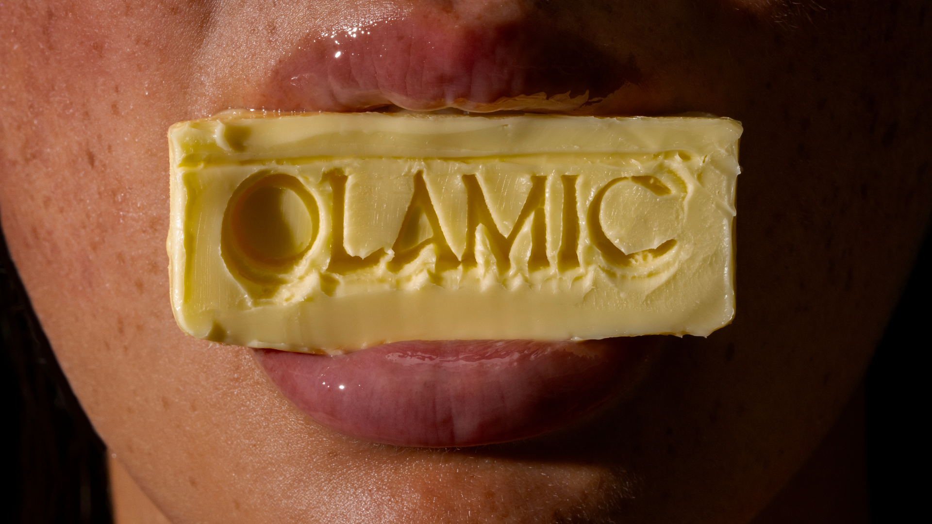 Editorial-style image featuring OLAMIC Retin-Algae Body Butter with brand logo
