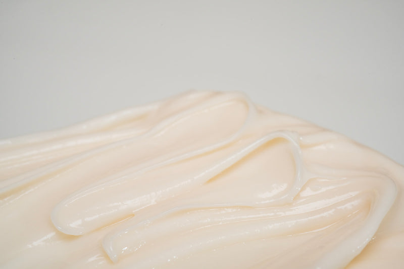 olamic body butter on white background
